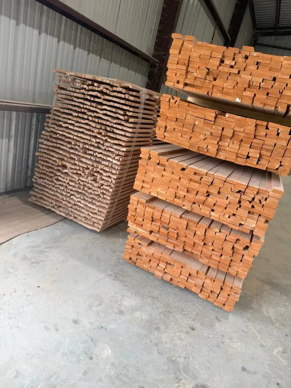 Stacks of S4S hardwood lumber staged in the Trinity Doors warehouse in Vidor, Texas